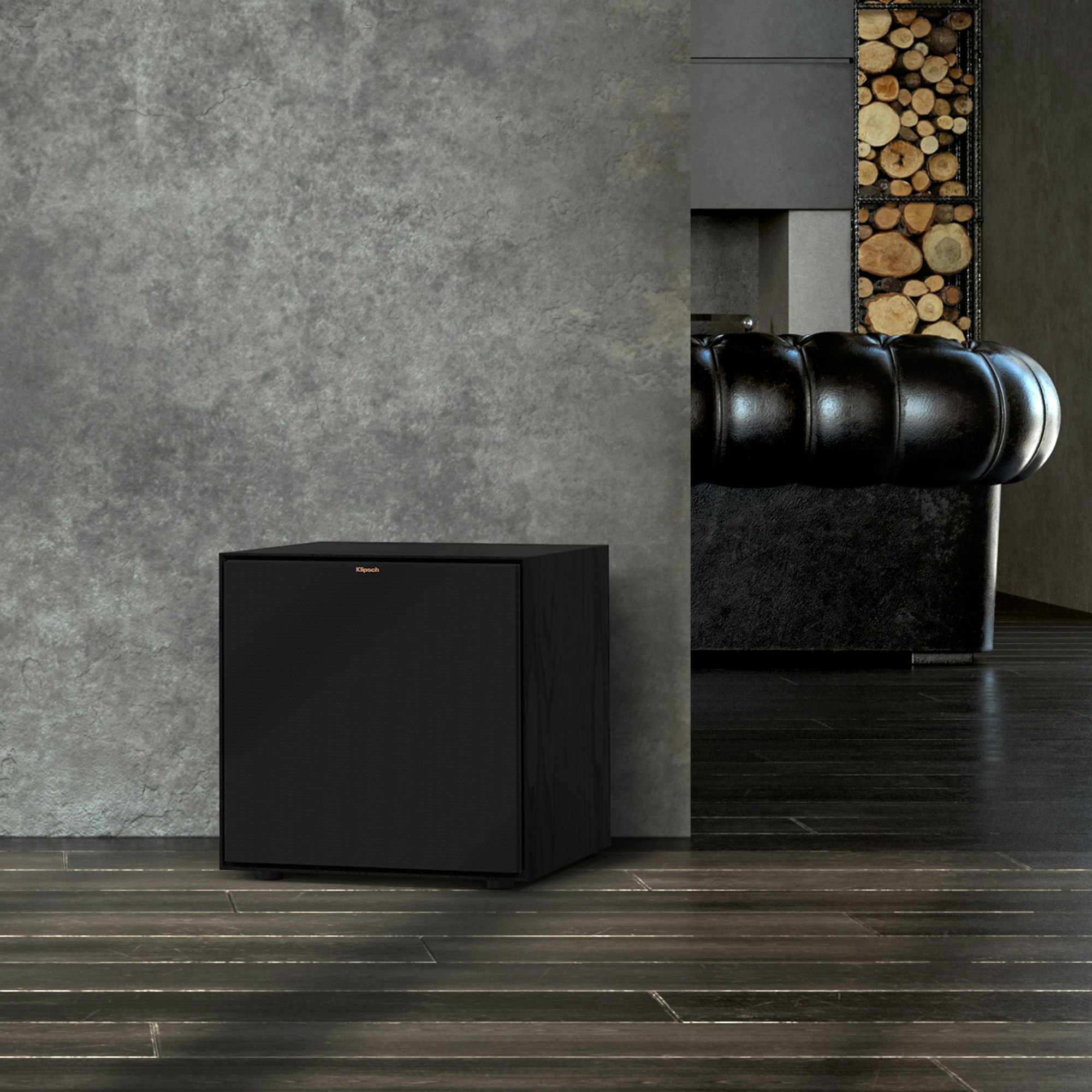 Reference Subwoofer R-121SW in front of a grey wall with the grille on